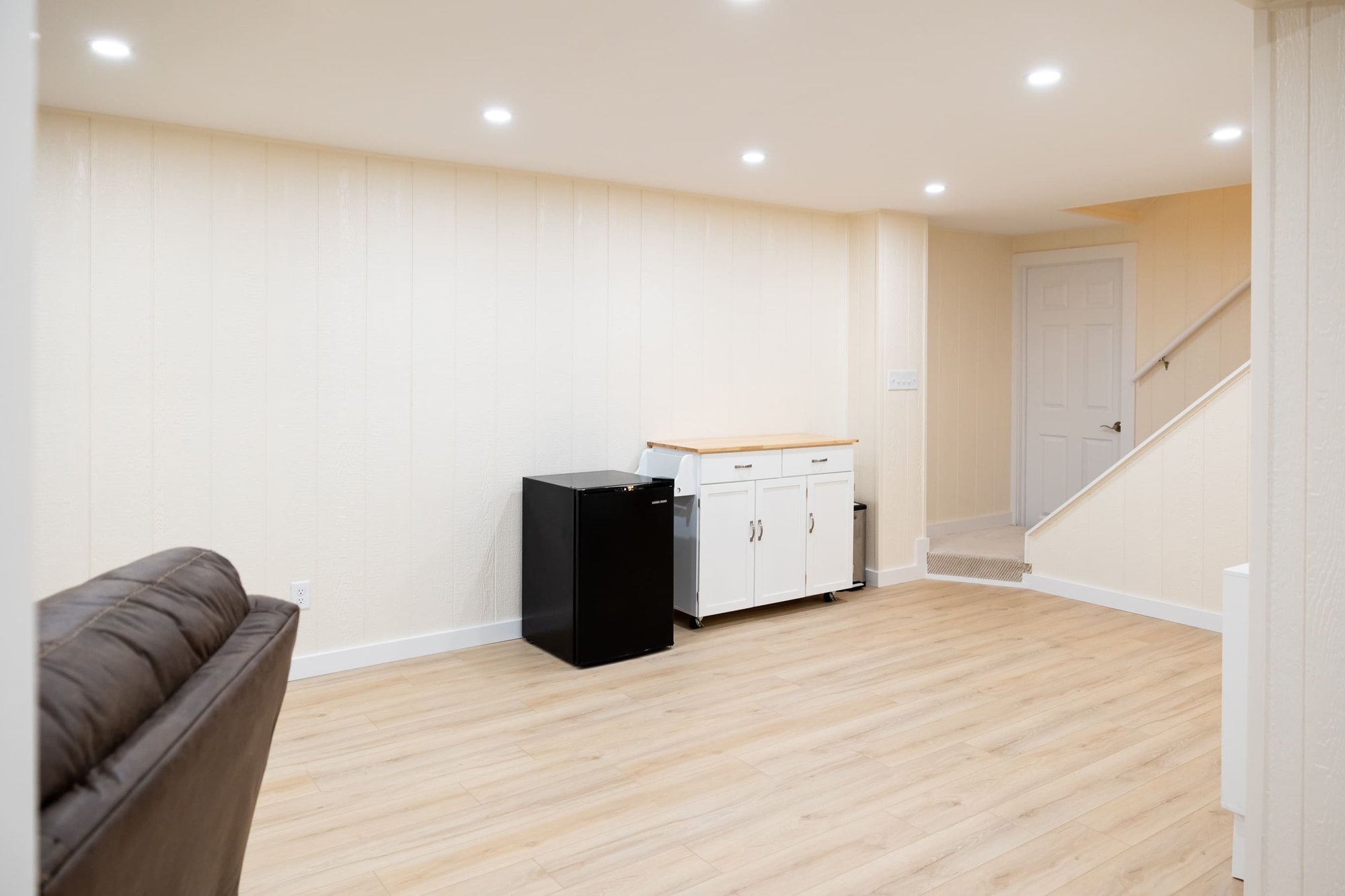 Mini fridge, in bight white open basement remodel